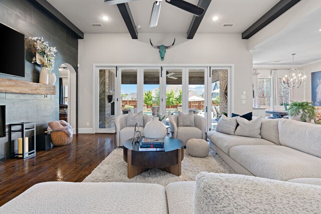 412 Appaloosa Run, Argyle, TX 76226 - living area with a ceiling fan, wood finished floors, beam ceiling, arched walkways, and a chandelier