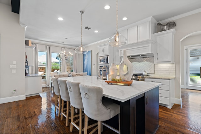 412 Appaloosa Run, Argyle, TX 76226 - kitchen with crown molding, white cabinets, backsplash, dark wood-style floors, and stainless steel microwave