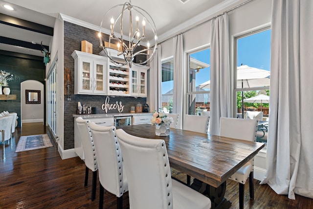 412 Appaloosa Run, Argyle, TX 76226 - dining room with bar, dark wood-type flooring, arched walkways, a chandelier, and baseboards