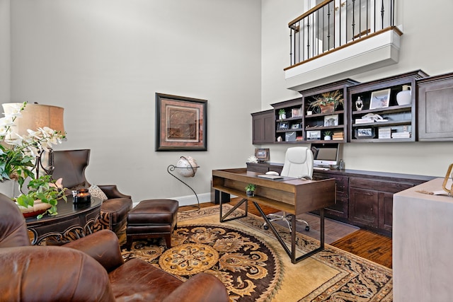 412 Appaloosa Run, Argyle, TX 76226 - office space featuring a high ceiling, wood finished floors, and baseboards