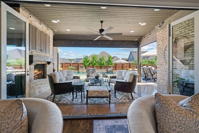 412 Appaloosa Run, Argyle, TX 76226 - view of patio / terrace with an outdoor living space with a fireplace, fence, and a ceiling fan