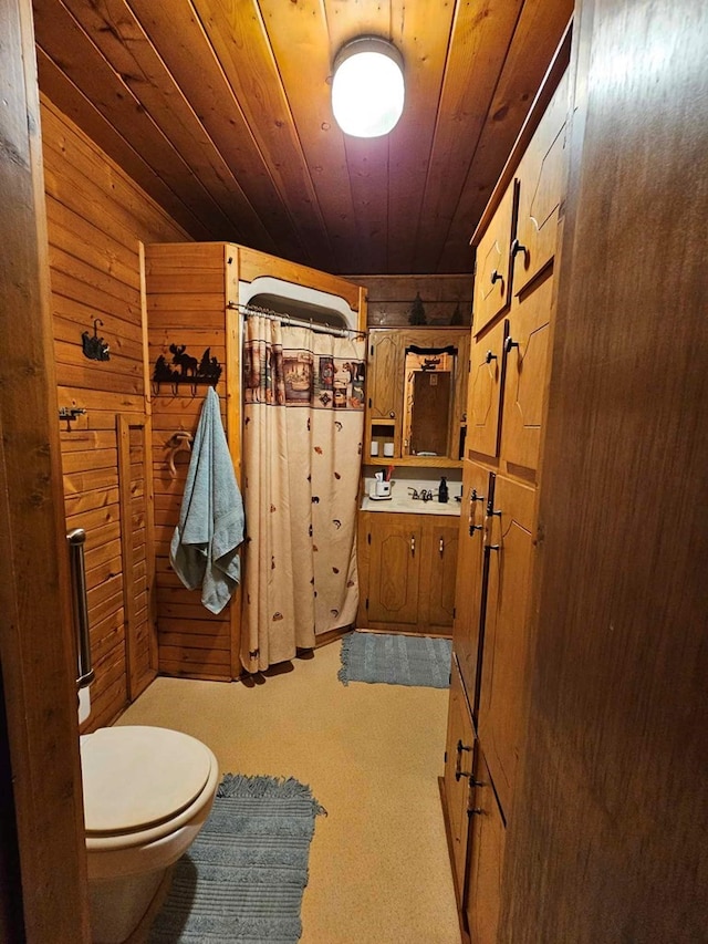 2488 Fm 2138 N, Jacksonville, TX 75766 - bathroom with wooden ceiling, wood walls, toilet, a shower with curtain, and vanity