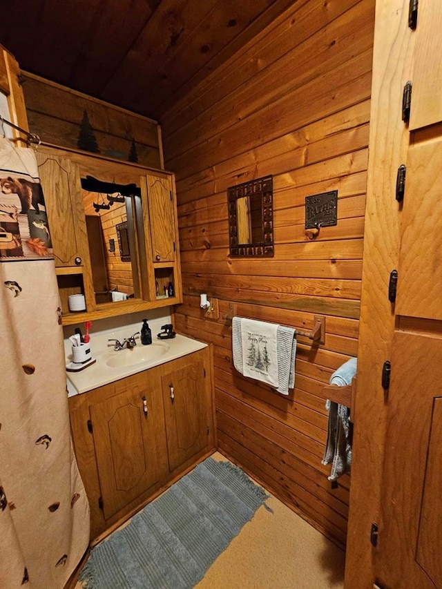 2488 Fm 2138 N, Jacksonville, TX 75766 - bathroom featuring wood walls, wood ceiling, and vanity