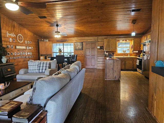 2488 Fm 2138 N, Jacksonville, TX 75766 - living area featuring a ceiling fan, wood ceiling, healthy amount of natural light, dark wood-type flooring, and vaulted ceiling