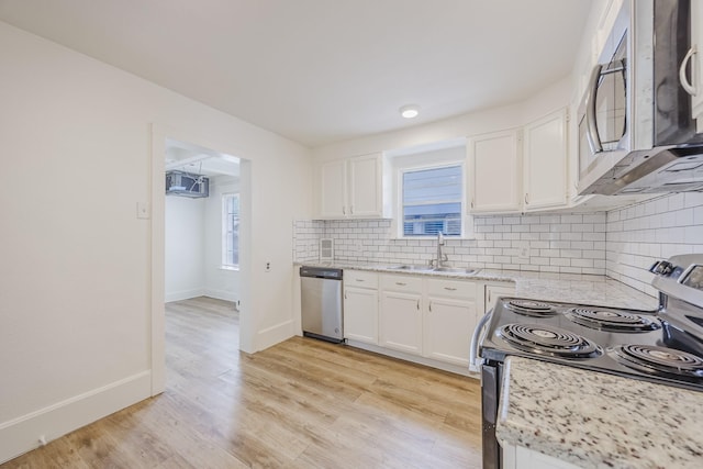 2741 Ivandell Ave, Dallas, TX 75211 - kitchen with stainless steel appliances, a sink, white cabinetry, and decorative backsplash
