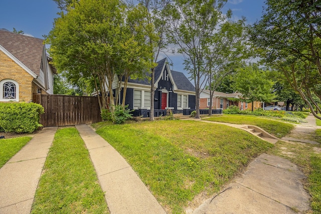 2741 Ivandell Ave, Dallas, TX 75211 - view of front of home featuring brick siding and roof with shingles