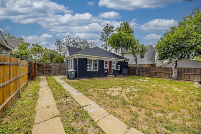 2741 Ivandell Ave, Dallas, TX 75211 - rear view of house with a gate, brick siding, a shingled roof, and central AC unit