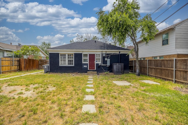 2741 Ivandell Ave, Dallas, TX 75211 - back of house featuring cooling unit and brick siding