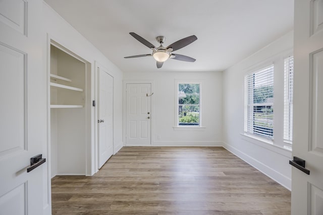 2741 Ivandell Ave, Dallas, TX 75211 - foyer with a ceiling fan, wood finished floors, and baseboards