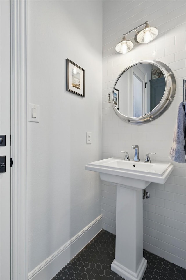 bathroom featuring tile patterned flooring and baseboards