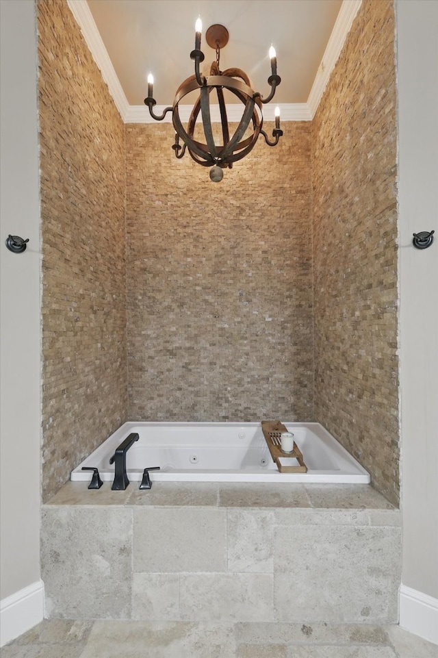 full bathroom with a chandelier, crown molding, and a tub with jets