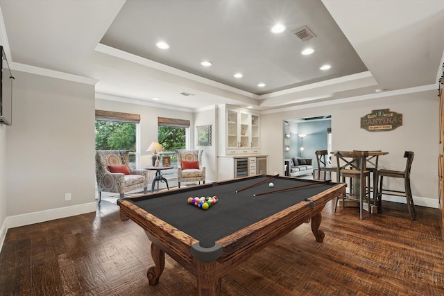 game room featuring a raised ceiling, wine cooler, baseboards, ornamental molding, and recessed lighting