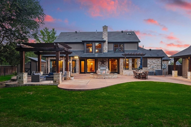 rear view of house with a pergola, central AC, a patio, and a chimney