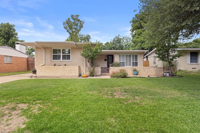 10209 Solta Dr, Dallas, TX 75218 - ranch-style house featuring brick siding and a front yard