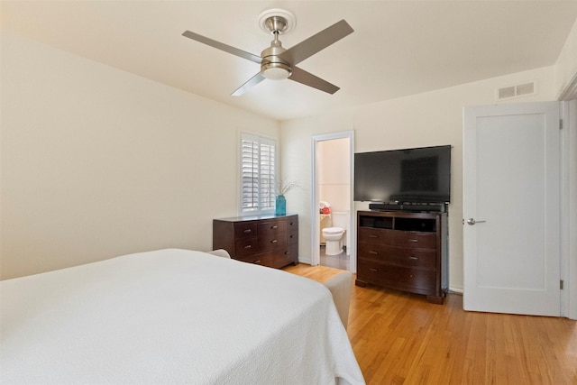 10209 Solta Dr, Dallas, TX 75218 - bedroom with light wood-style floors, ensuite bath, and ceiling fan