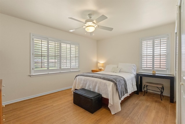 10209 Solta Dr, Dallas, TX 75218 - bedroom featuring wood finished floors, baseboards, and a ceiling fan