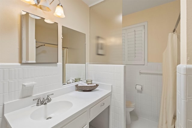 10209 Solta Dr, Dallas, TX 75218 - bathroom with tile walls, toilet, wainscoting, vanity, and a shower with curtain