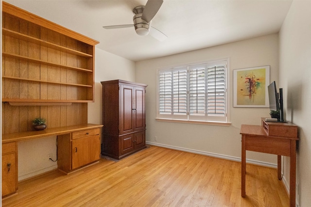 10209 Solta Dr, Dallas, TX 75218 - unfurnished office with a ceiling fan, light wood-style flooring, and baseboards