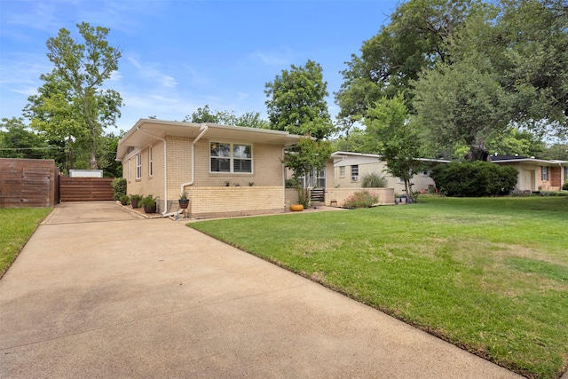 10209 Solta Dr, Dallas, TX 75218 - view of front of home with brick siding and concrete driveway