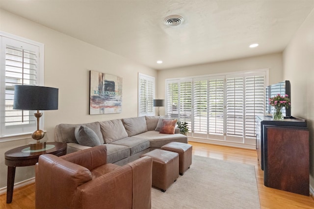 10209 Solta Dr, Dallas, TX 75218 - living area featuring light wood-style floors and recessed lighting