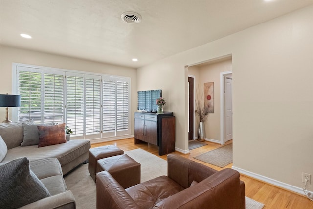 10209 Solta Dr, Dallas, TX 75218 - living area with light wood-style floors, baseboards, and recessed lighting