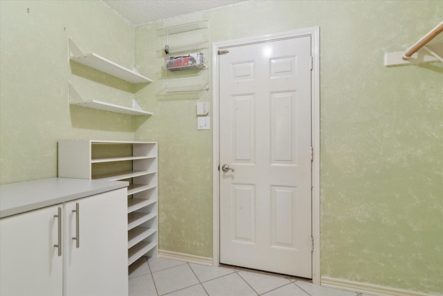spacious closet with light tile patterned flooring