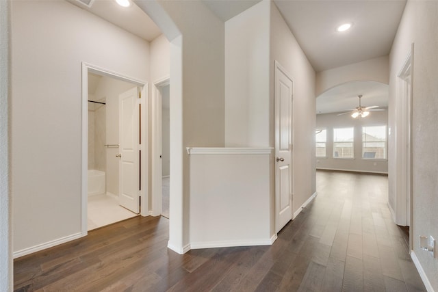 4505 Ridgehurst Ln, Fort Worth, TX 76036 - hallway with arched walkways, dark wood-type flooring, baseboards, and recessed lighting