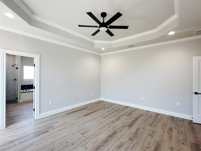 6710 Windmill Grass Ln, Abilene, TX 79606 - unfurnished room featuring a raised ceiling, a ceiling fan, light wood-type flooring, ornamental molding, and recessed lighting