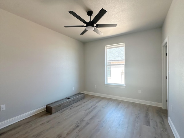 6710 Windmill Grass Ln, Abilene, TX 79606 - empty room with wood finished floors, baseboards, and ceiling fan