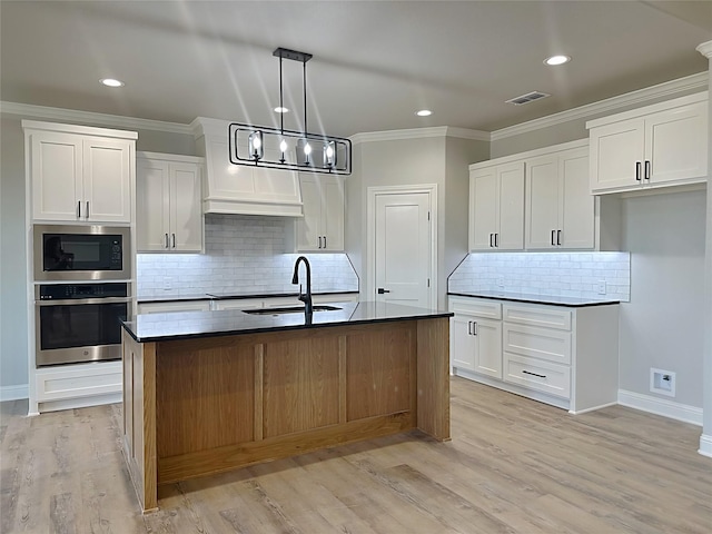 6710 Windmill Grass Ln, Abilene, TX 79606 - kitchen with stainless steel oven, a sink, dark countertops, built in microwave, and crown molding