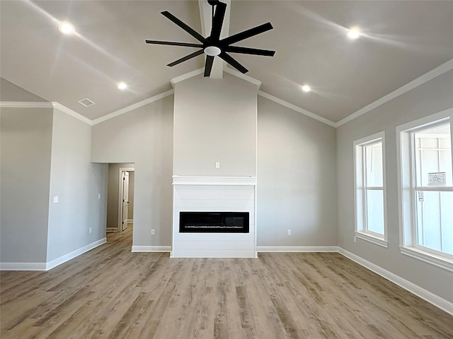 6710 Windmill Grass Ln, Abilene, TX 79606 - unfurnished living room with a ceiling fan, a glass covered fireplace, crown molding, wood finished floors, and baseboards