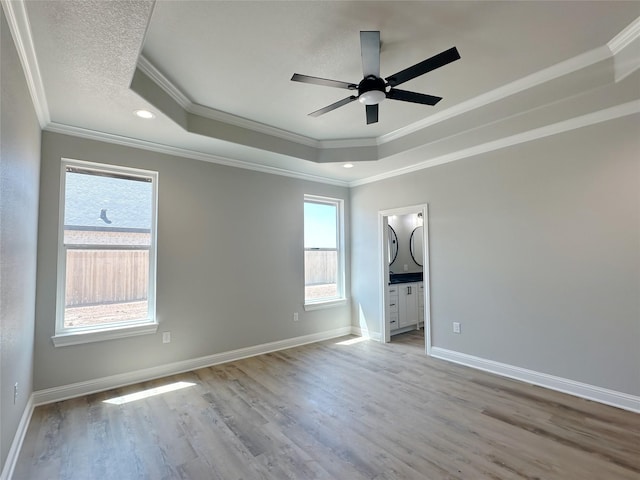 6710 Windmill Grass Ln, Abilene, TX 79606 - empty room with ornamental molding, a raised ceiling, a ceiling fan, light wood-type flooring, and recessed lighting