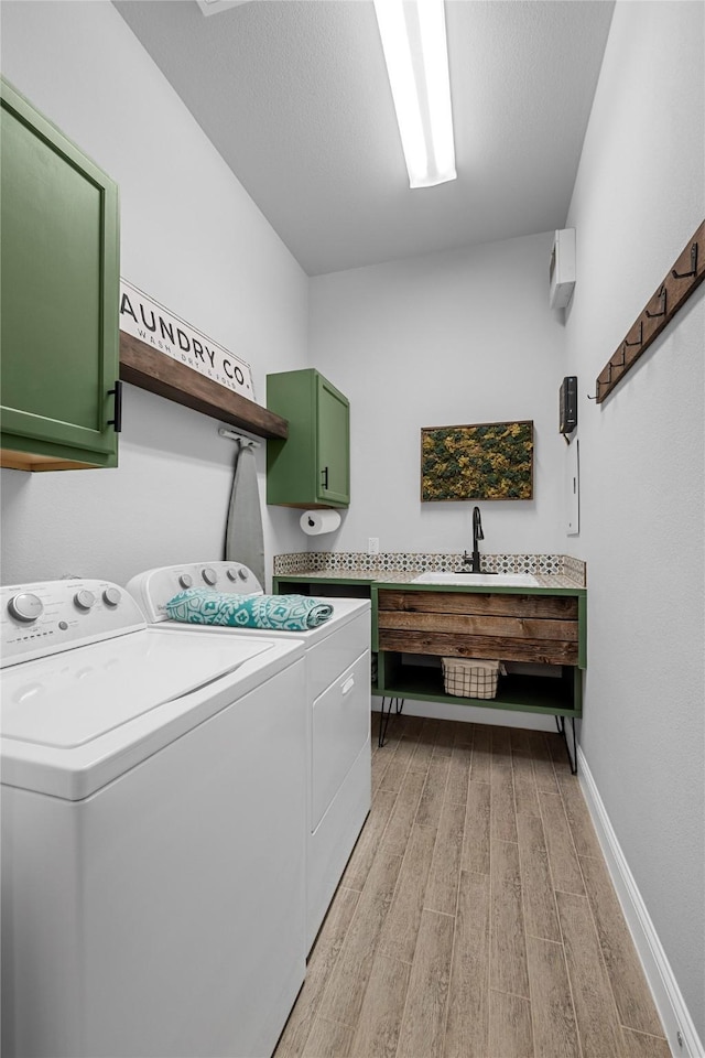 4530 Crossvine Dr, Prosper, TX 75078 - washroom with cabinet space, washer and dryer, light wood-type flooring, and baseboards
