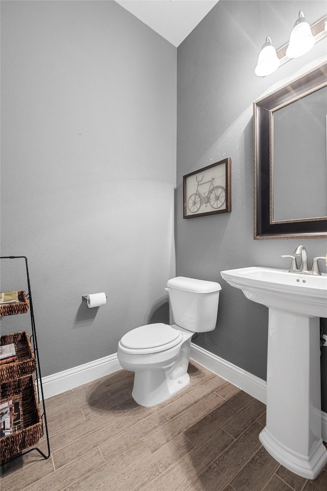 4530 Crossvine Dr, Prosper, TX 75078 - bathroom with wood finished floors, toilet, and baseboards