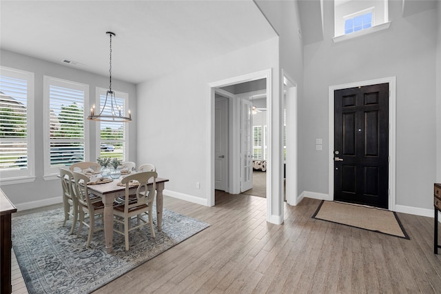4530 Crossvine Dr, Prosper, TX 75078 - dining area featuring wood finished floors, a chandelier, and plenty of natural light