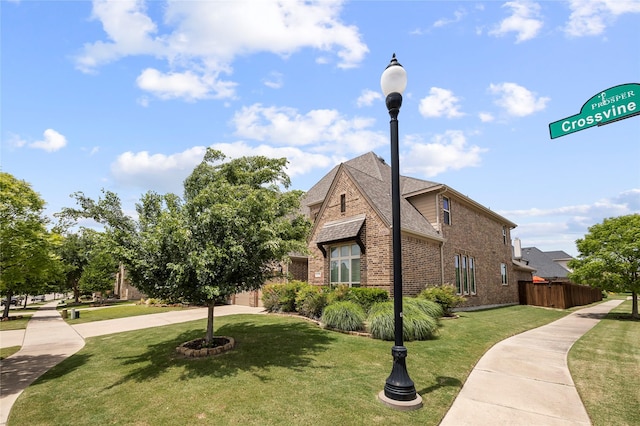 4530 Crossvine Dr, Prosper, TX 75078 - view of home's exterior with brick siding, a shingled roof, and concrete driveway