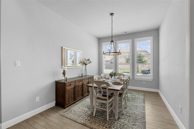 4530 Crossvine Dr, Prosper, TX 75078 - dining area with a chandelier, light wood-style floors, and plenty of natural light