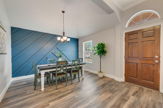 110 Redwood, Terrell, TX 75160 - dining area featuring a chandelier, baseboards, wood finished floors, and crown molding
