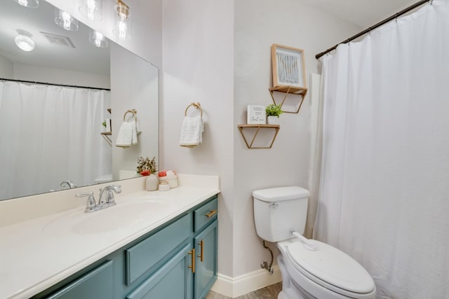 110 Redwood, Terrell, TX 75160 - full bath with toilet, vanity, wood finished floors, and baseboards