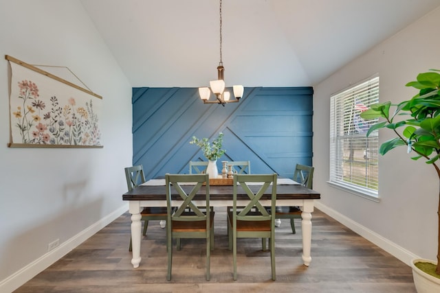 110 Redwood, Terrell, TX 75160 - dining room featuring a chandelier, vaulted ceiling, dark wood-style floors, and baseboards