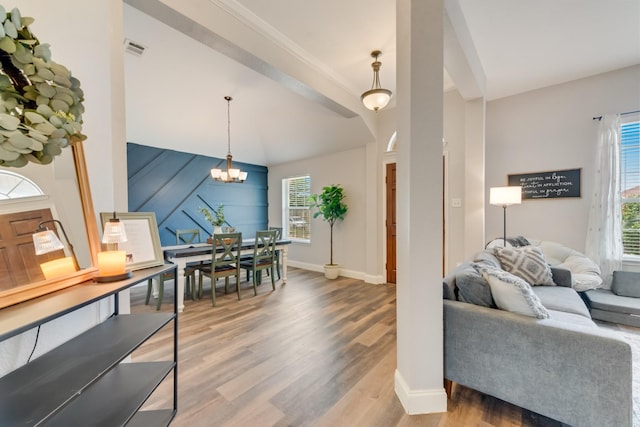 110 Redwood, Terrell, TX 75160 - living room featuring wood finished floors, a chandelier, and baseboards