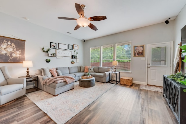 110 Redwood, Terrell, TX 75160 - living area with wood finished floors, a ceiling fan, and baseboards