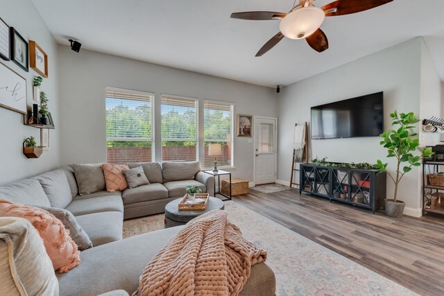 110 Redwood, Terrell, TX 75160 - living area featuring a ceiling fan, wood finished floors, and baseboards