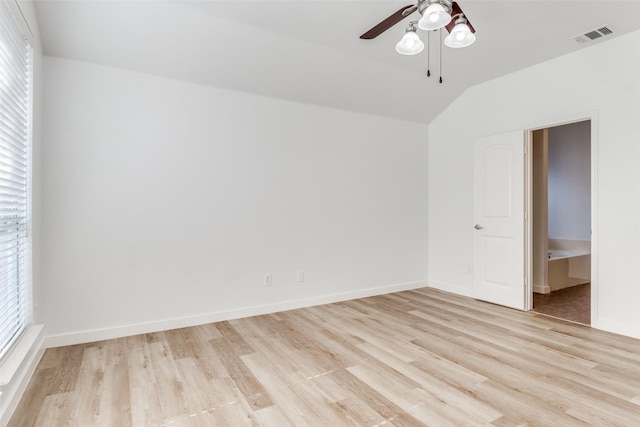 unfurnished bedroom with light wood-style floors, baseboards, vaulted ceiling, and a ceiling fan