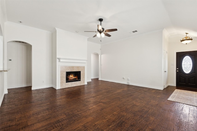 9709 Maryville Ln, Fort Worth, TX 76108 - unfurnished living room with arched walkways, ceiling fan, wood finished floors, and a tile fireplace