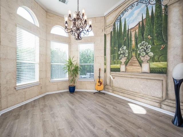 2302 Creek Crossing Dr, Corinth, TX 76210 - unfurnished dining area featuring wood finished floors, a chandelier, and ornamental molding