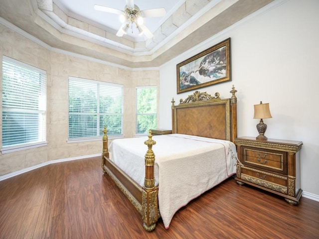 2302 Creek Crossing Dr, Corinth, TX 76210 - bedroom with wood finished floors, a raised ceiling, ornamental molding, baseboards, and a ceiling fan