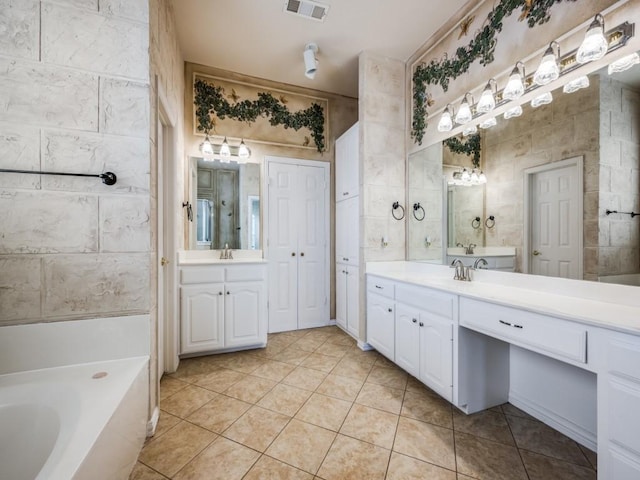 2302 Creek Crossing Dr, Corinth, TX 76210 - full bath with tile patterned floors, a bath, and two vanities