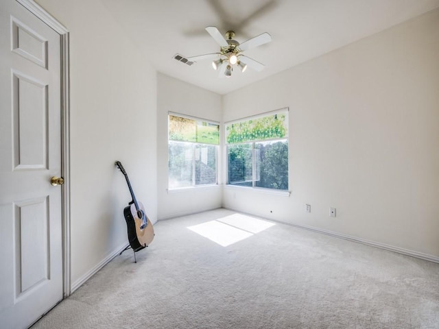 2302 Creek Crossing Dr, Corinth, TX 76210 - carpeted spare room featuring a ceiling fan and baseboards