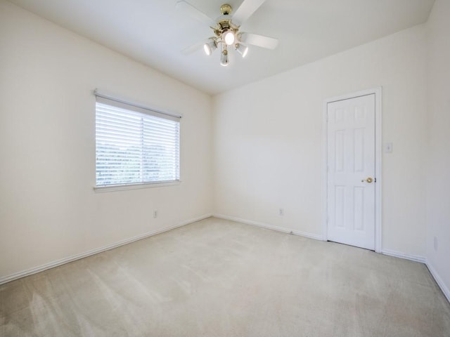 2302 Creek Crossing Dr, Corinth, TX 76210 - unfurnished room with light carpet, a ceiling fan, and baseboards